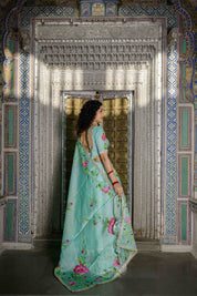 Green lehenga set with pastel pink floral prints and silver gota work

