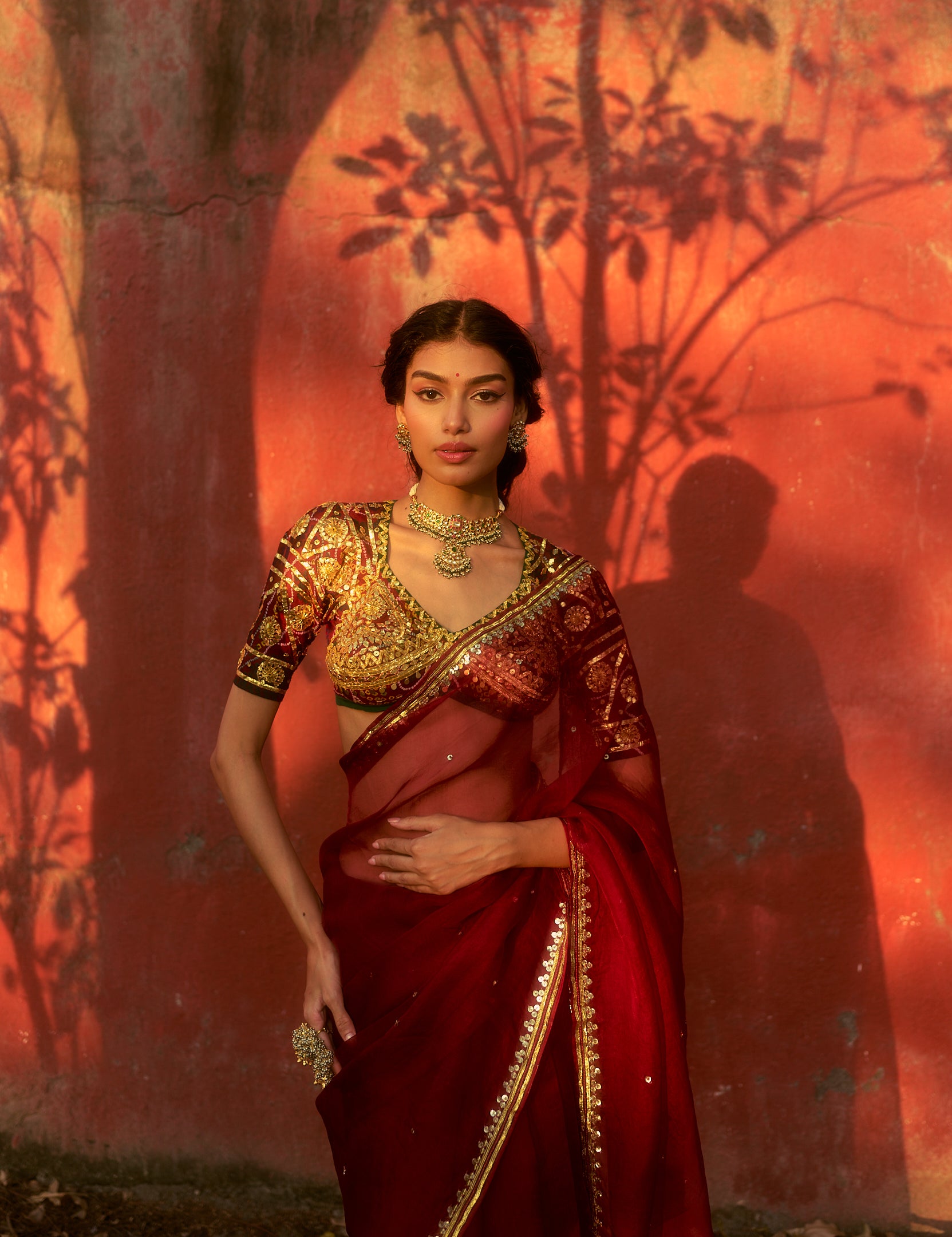 Model wearing the Kumud Bandhej Aangi Saree Set styled for festive gatherings and wedding celebrations