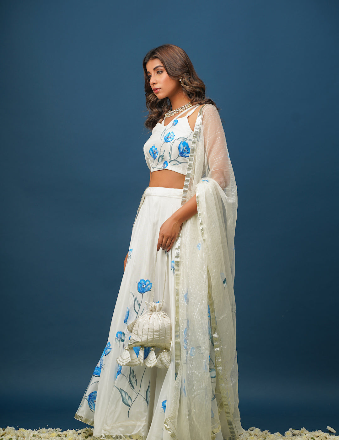 Full lehenga set laid out with blouse, skirt, and dupatta
