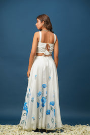 Full lehenga set laid out with blouse, skirt, and dupatta back si