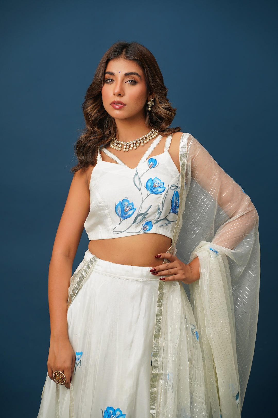 Full lehenga set laid out with blouse, skirt, and dupatta