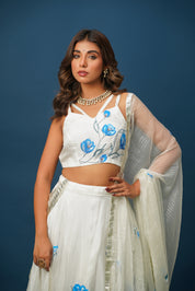 Full lehenga set laid out with blouse, skirt, and dupatta