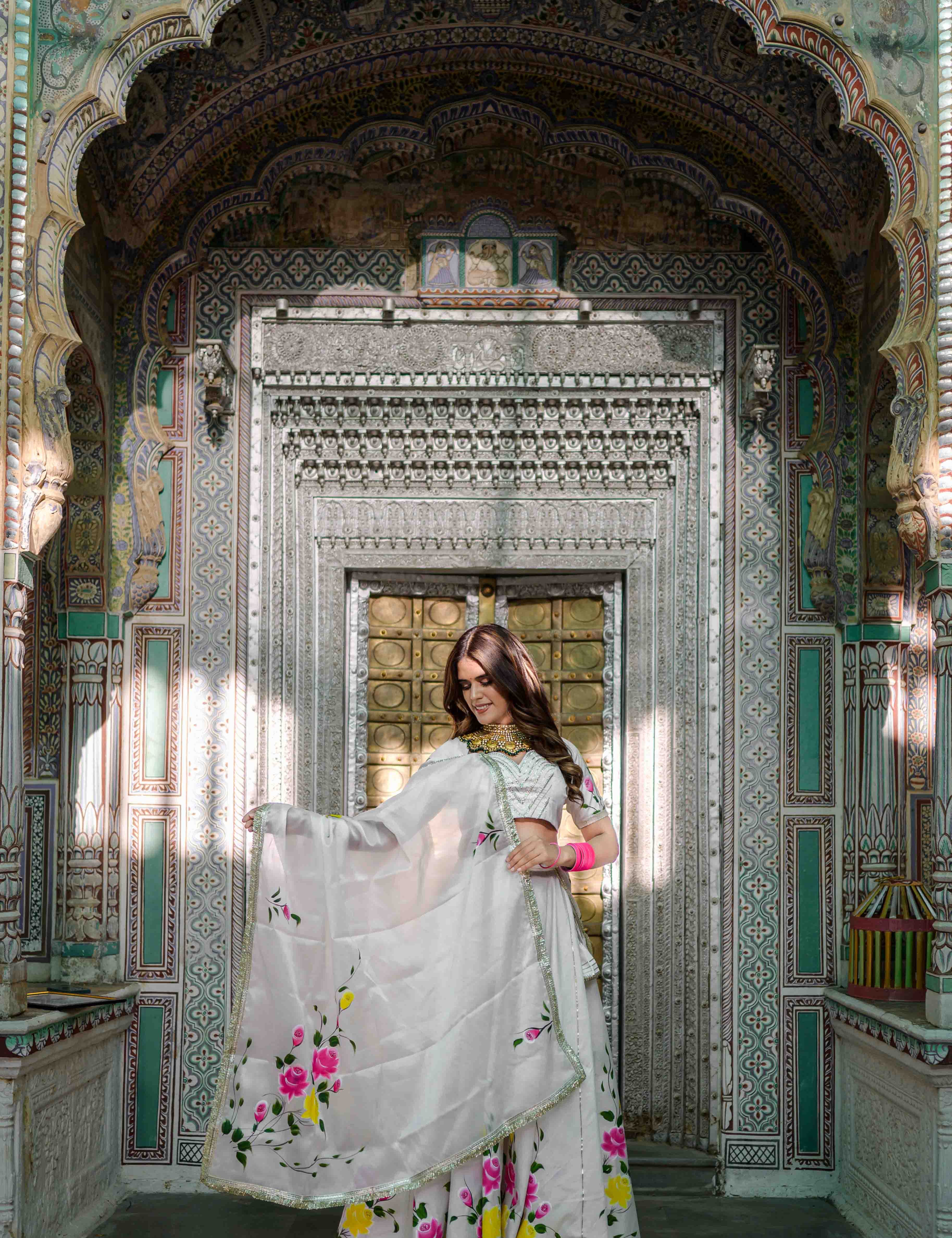 Elegant bridal white lehenga with red organza dupatta

