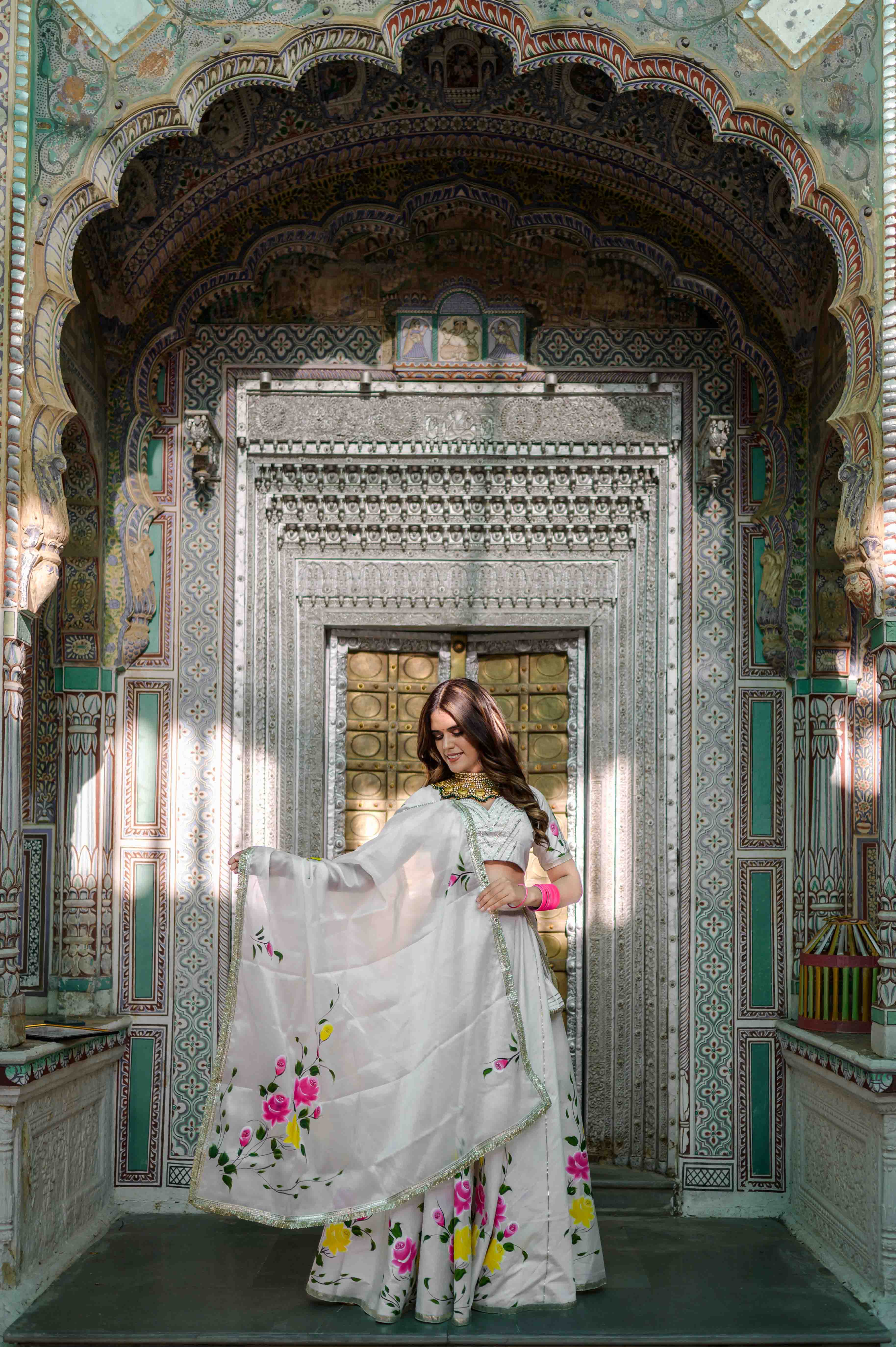 Elegant bridal white lehenga with red organza dupatta

