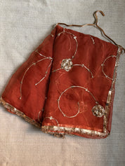 Chameli rust orange pure organza saree with copper Charkhi Gota jaal, House of Baisa