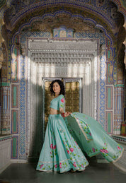 Traditional Indian outfit with floral design and net dupatta


