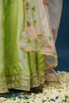 Elegant festive look in Maya green lehenga set with minimal jewelry
