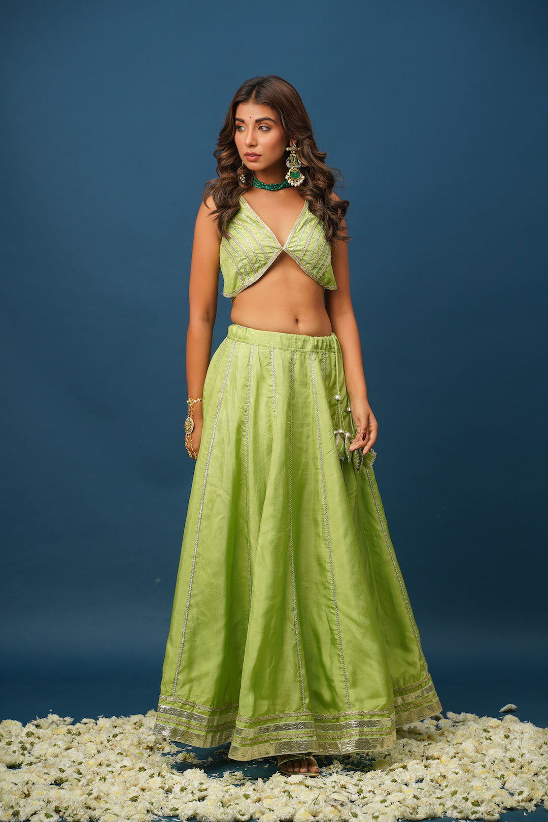 Twirl pose in flowy green lehenga with gota border
