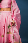 Traditional yet modern pink lehenga ensemble with matching accessories

