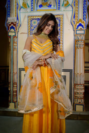 Close-up of hand-applied gota detailing on orange blouse and dupatta
