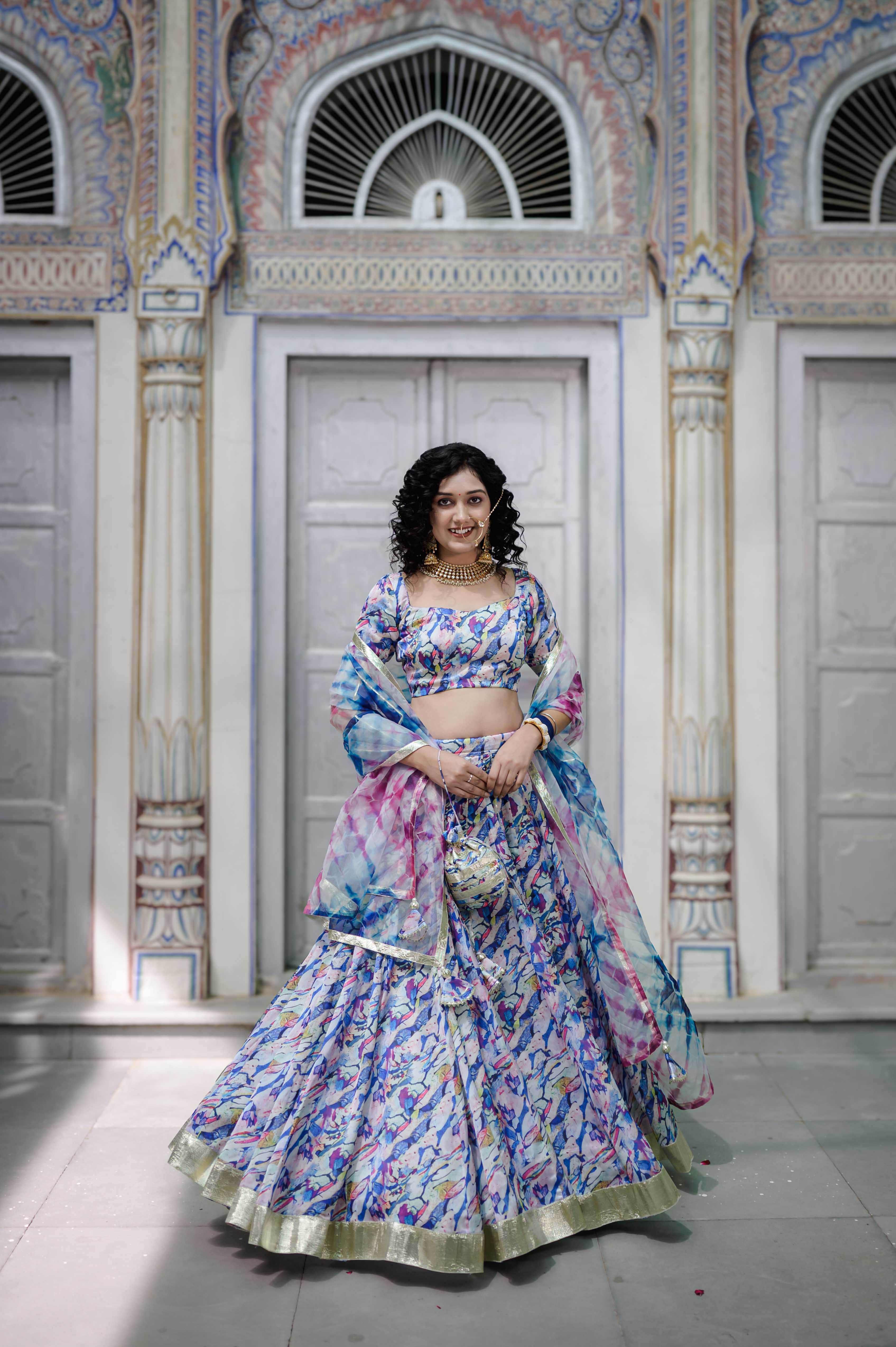 Model wearing pastel marble satin lehenga 