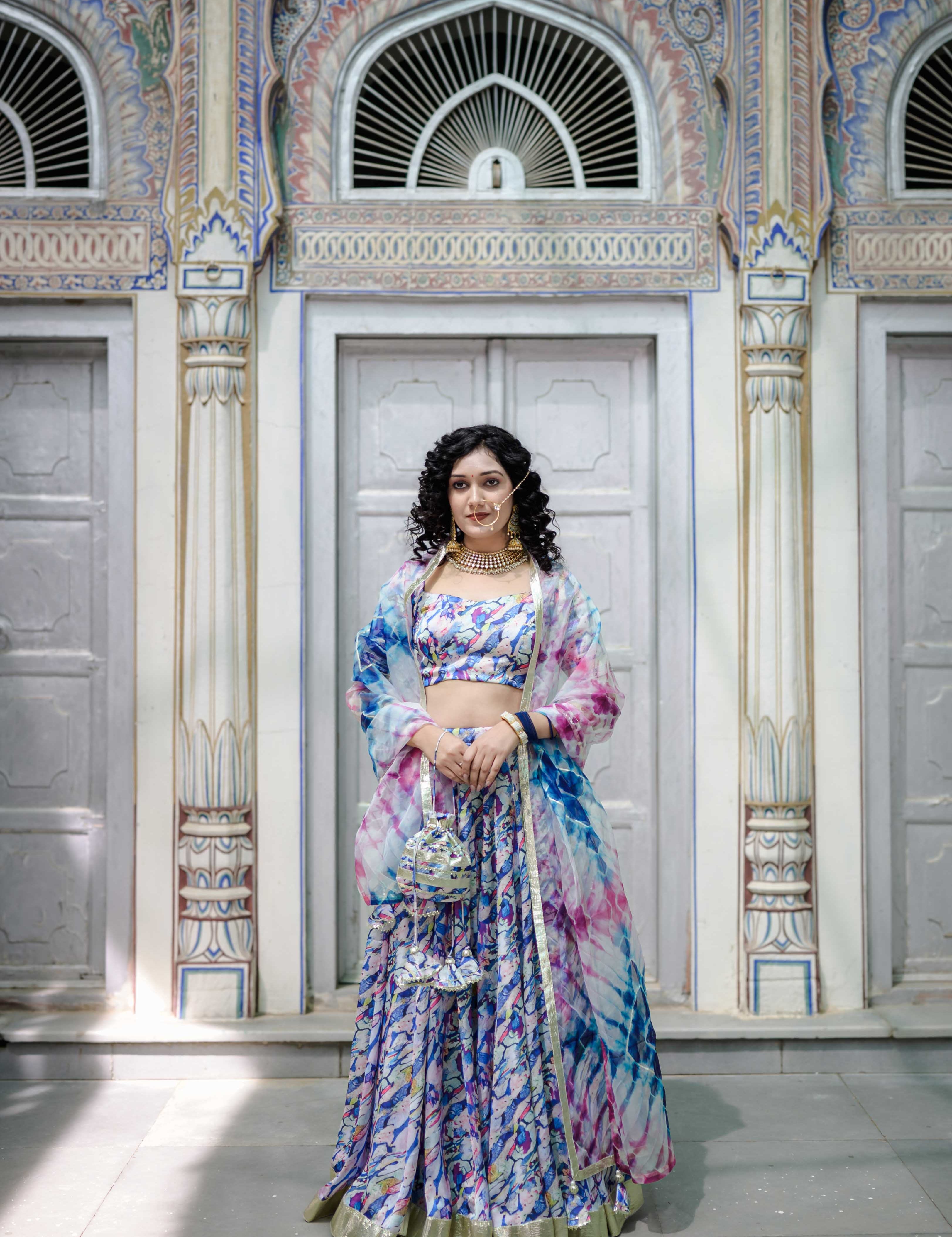 Model wearing pastel marble satin lehenga with organza dupatta 