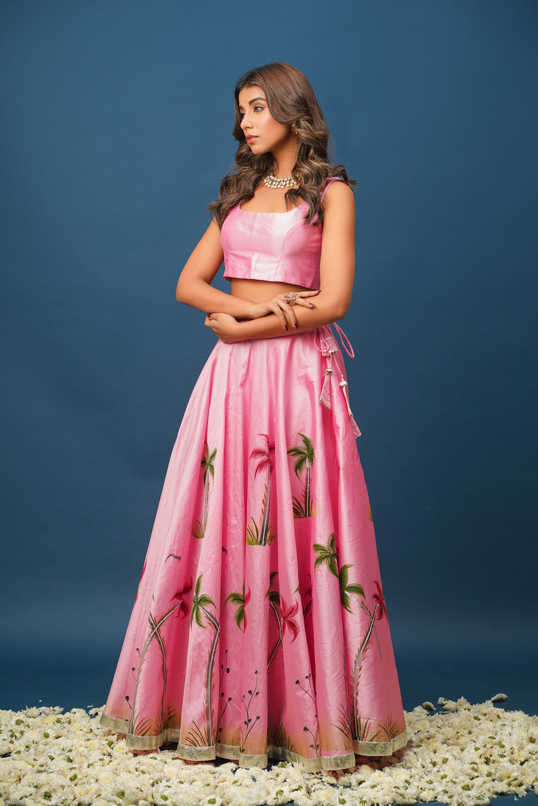 Bridesmaid outfit idea in pastel pink lehenga with subtle gota work

