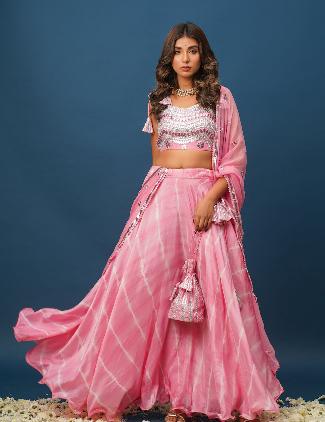 Woman in pink satin lehenga with khara gota embroidery
