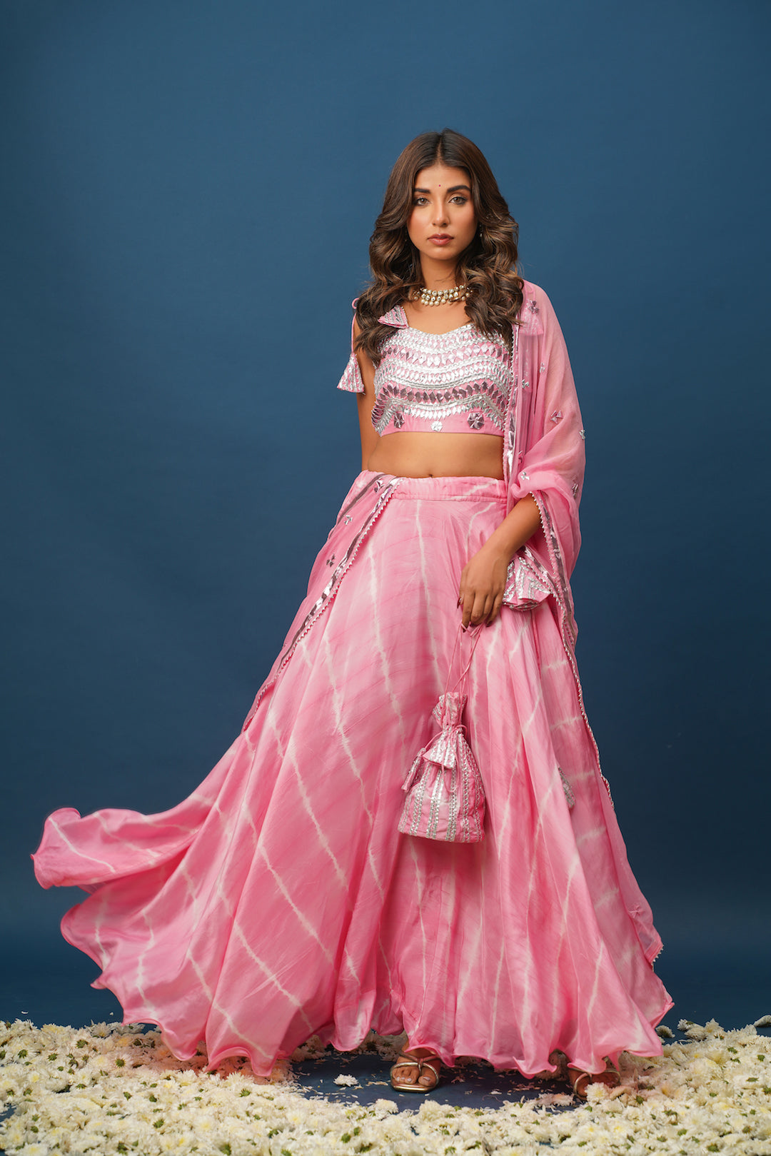 Woman in pink satin lehenga with khara gota embroidery
