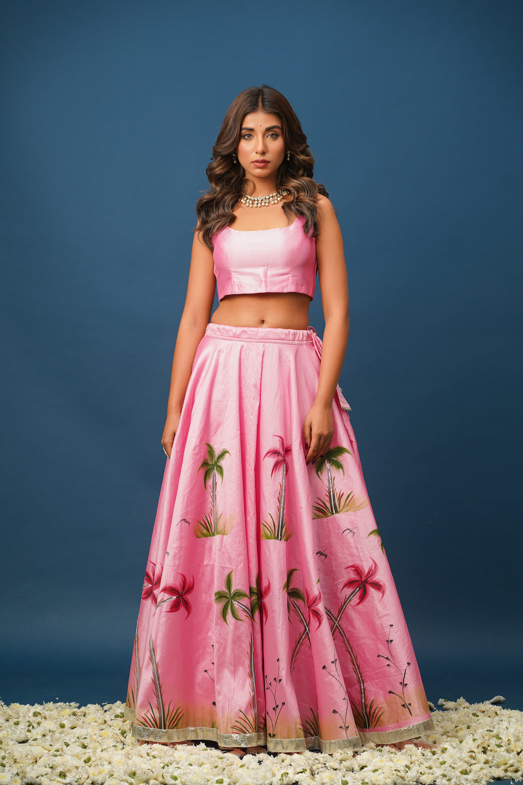 Back view of Mandakini pink lehenga with detailed dupatta drape and blouse design

