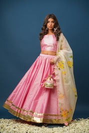 Model in Harshita pink lehenga with floral hand-painted design

