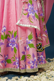 Close-up of floral painting on lehenga skirt
