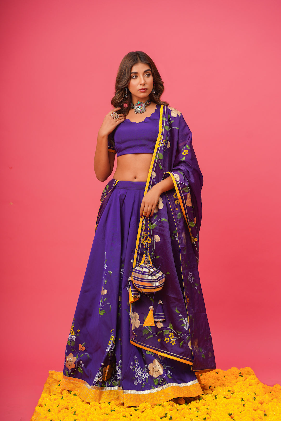 Full-length shot of violet lehenga with intricate blouse embroidery
