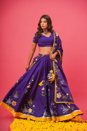 Elegant violet lehenga set with gota work styled for festive occasions
