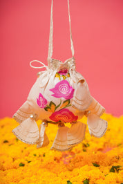 White lehenga set styled with matching dupatta, accessories, and pastel makeup for a soft bridal look
