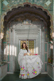 Full view of white floral lehenga set for women

