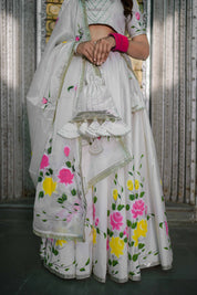 Back view of handcrafted white lehenga with blouse and dupatta

