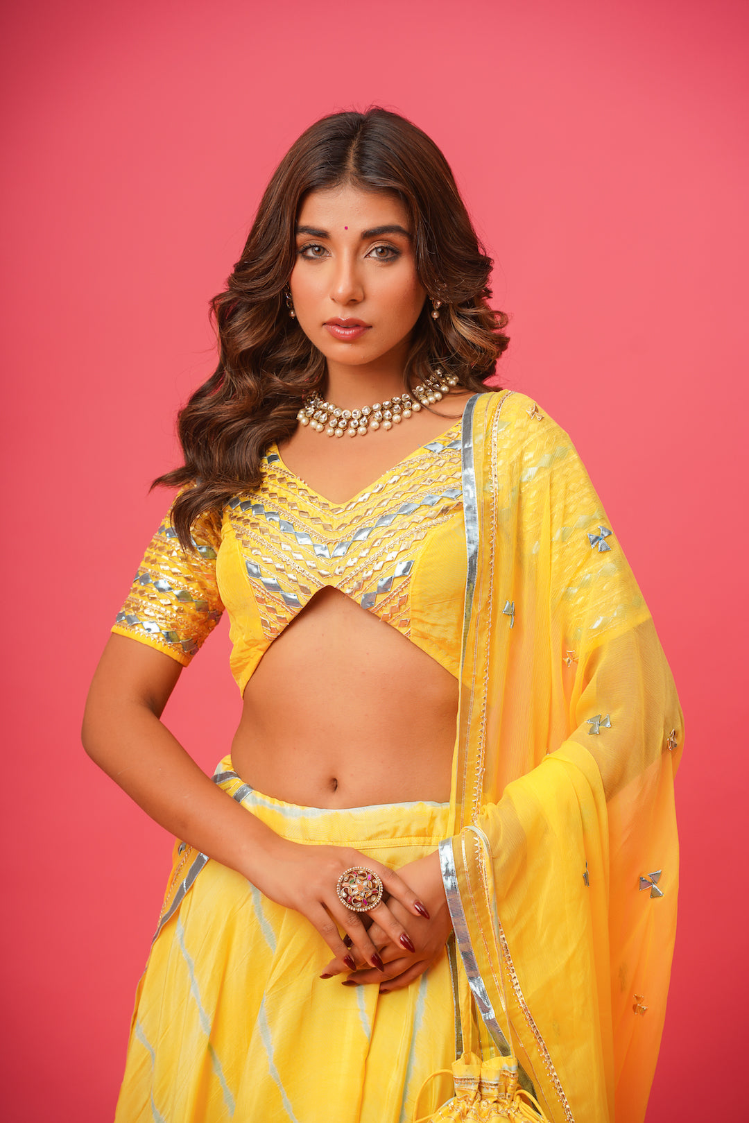 Model wearing yellow Khara Gota silk lehenga with matching dupatta

